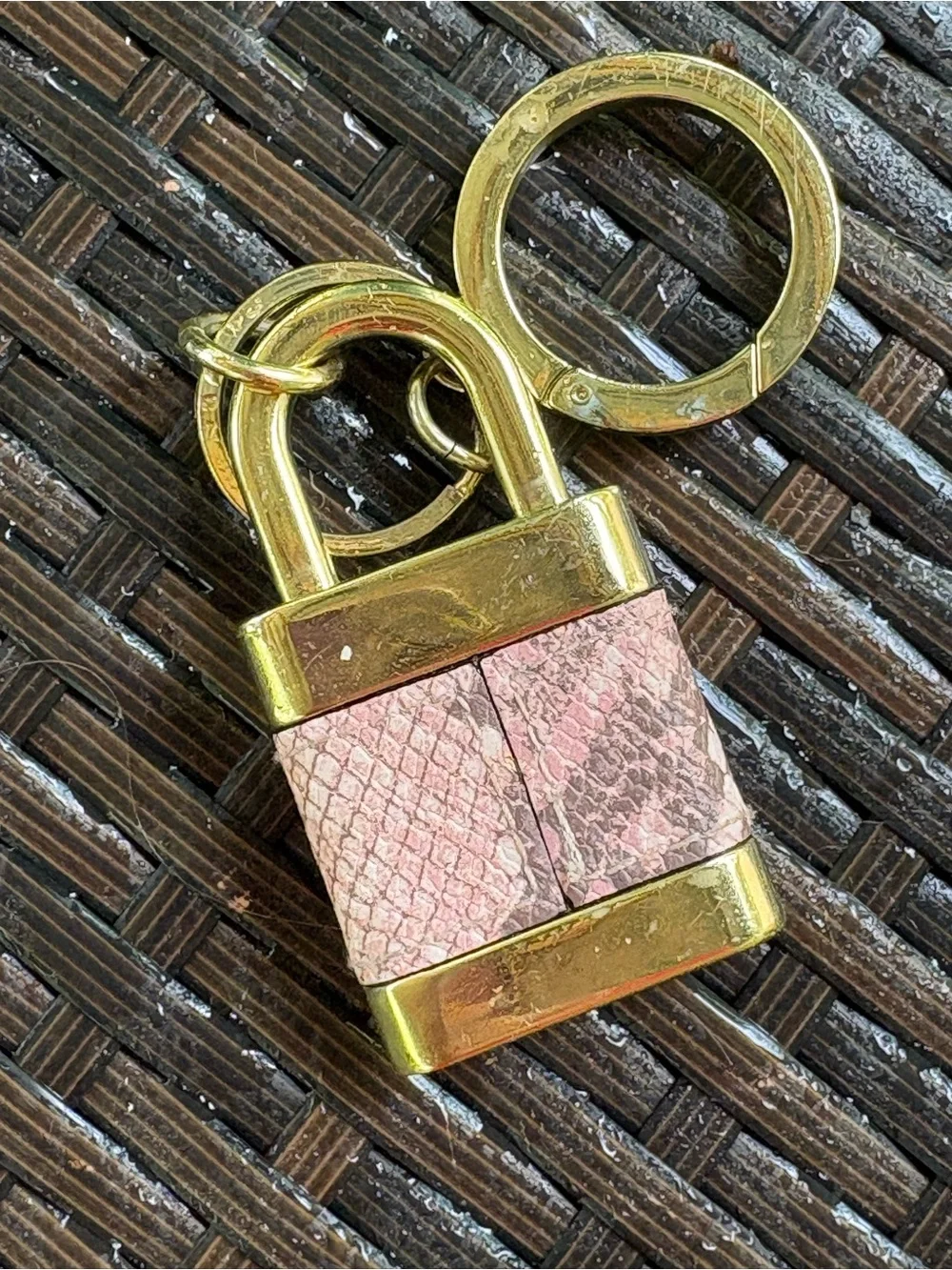 Victoria's Secret padlock keychain features a rose gold finish and a pink snakes